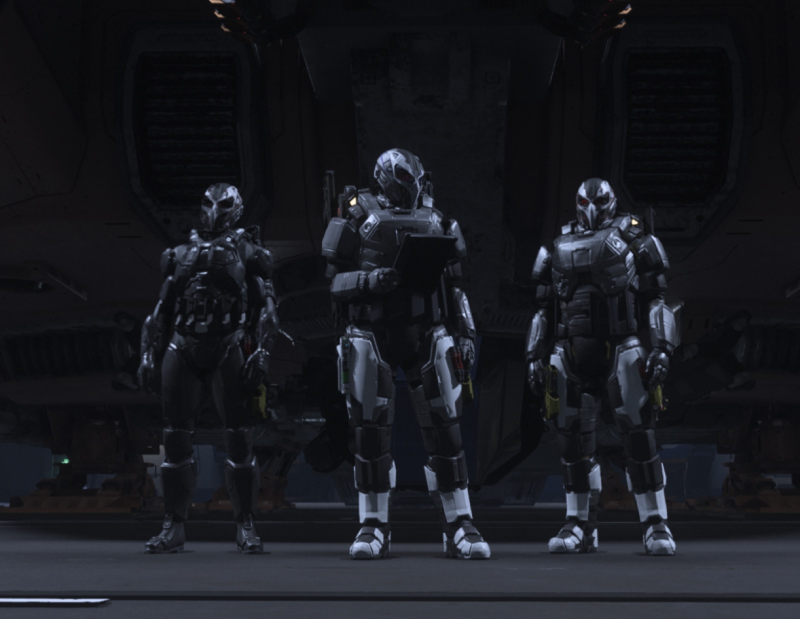 Three Raven Unit operators in low-observable armor standing at the ramp of a dropship, the center operator reading a datapad